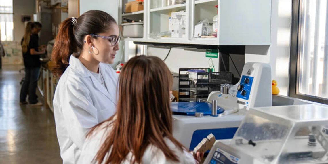 Two young women working together in a university lab